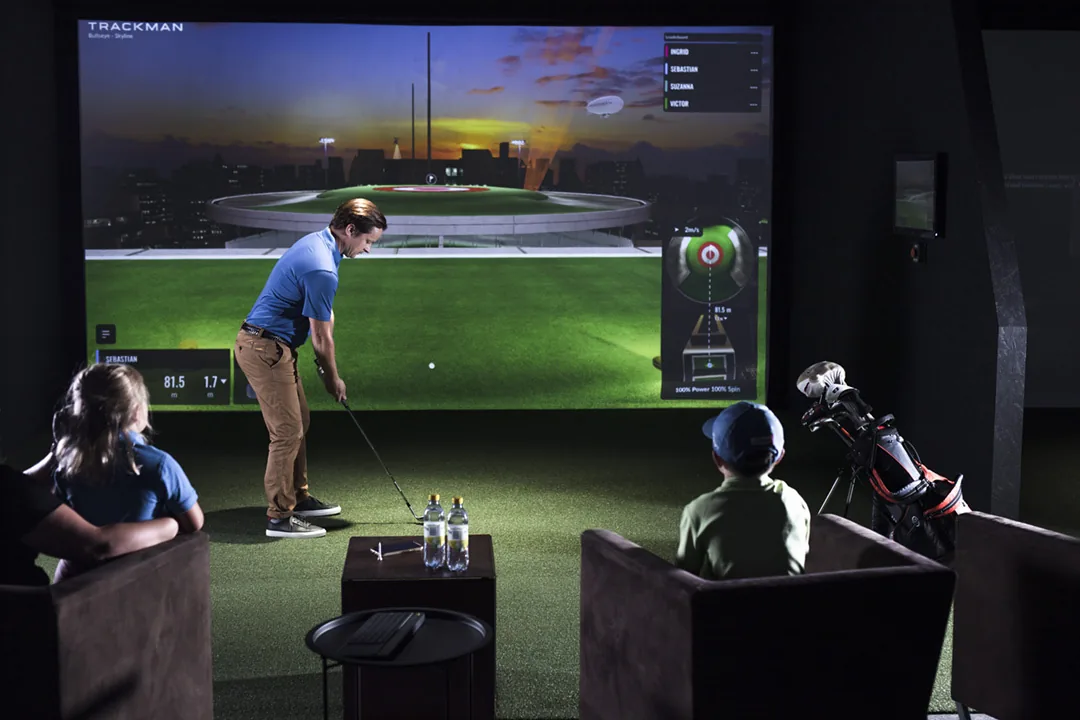 Family enjoying fun and games in a Trackman studio bay